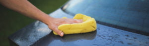 cleaning a car with sponge